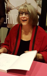 Marilyn Brooks signing a copy of Behind the Seams. Photo by Norma Menneguzzi Spall.