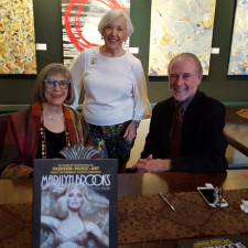 Marilyn Brooks poses with co-author Peter Jennings and Zora Buchanan, host of the event at the Arts and Letters Club in Toronto.