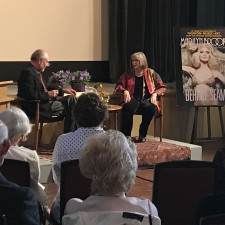 Peter Jennings poses a question to Marilyn Brooks at the Arts and Letters Club Toronto. Photo credit Darilyn Coles.